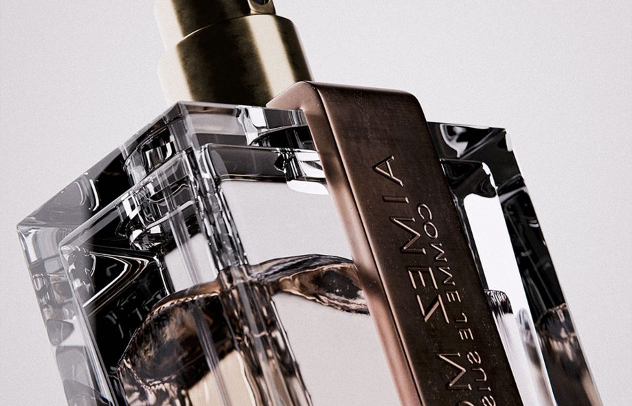 Luxurious perfume bottle with metallic cap and transparent glass display, ideal for high-end fragrance branding.