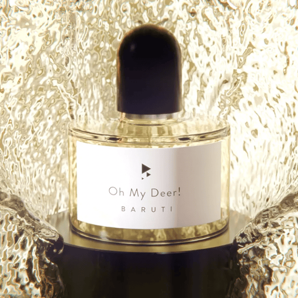 Luxurious perfume bottle featuring metallic splash display for high-end fragrance branding.