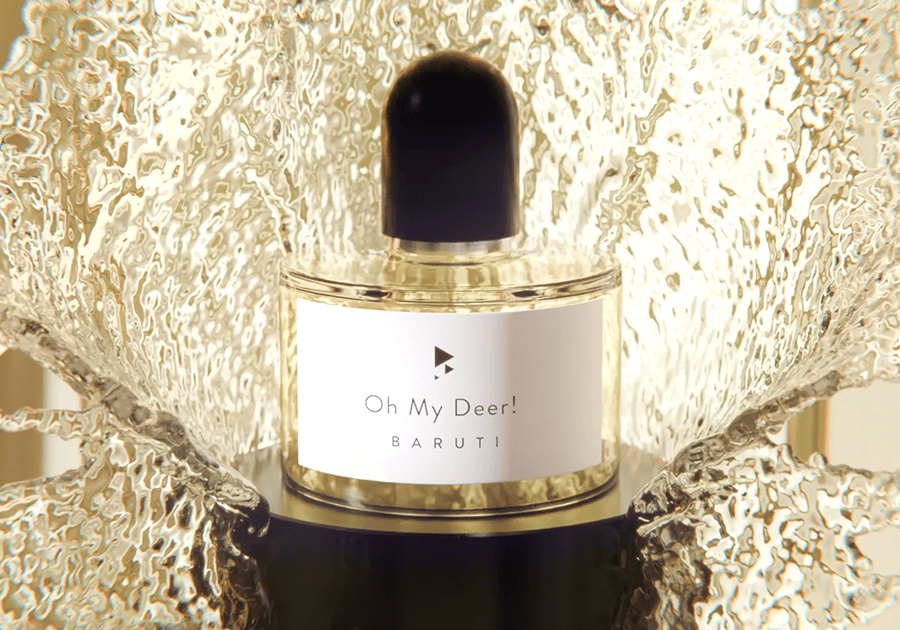 Luxurious perfume bottle featuring metallic splash display for high-end fragrance branding.