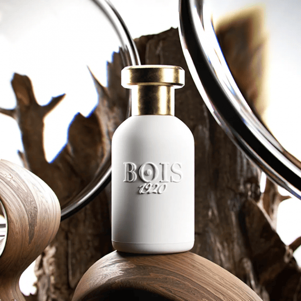Elegant Bois 1920 fragrance bottle with gold cap, stylish decor.